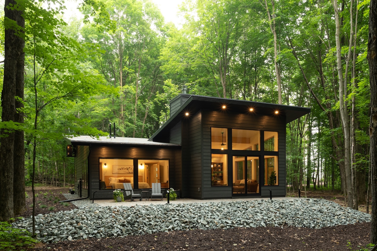 Stay at the most romantic cabin rental in Wisconsin, located in a secluded 10-acre forest. Here you can see the sleek facade of the cabin itself. 