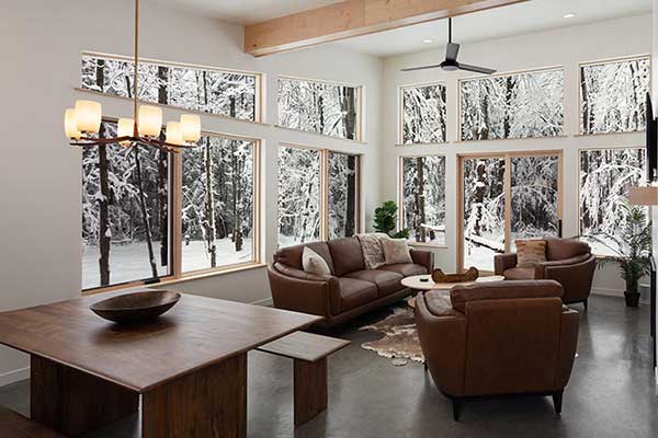 Interior Living Room with a couch and chairs, the perfect place to come home to after enjoying all of the best things to do in Wausau, WI - and part of our luxury cabin in Wisconsin, one of the best cabin rentals in Wisconsin.