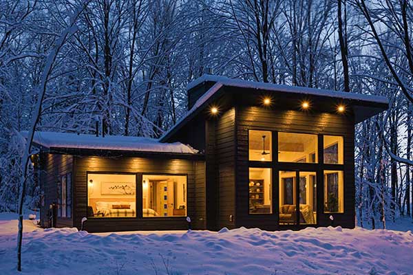 Exterior Cabin in the Snow with Lights