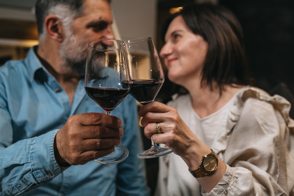 Couple drinking wine during their romantic getaways at our luxury cabins in Wisconsin