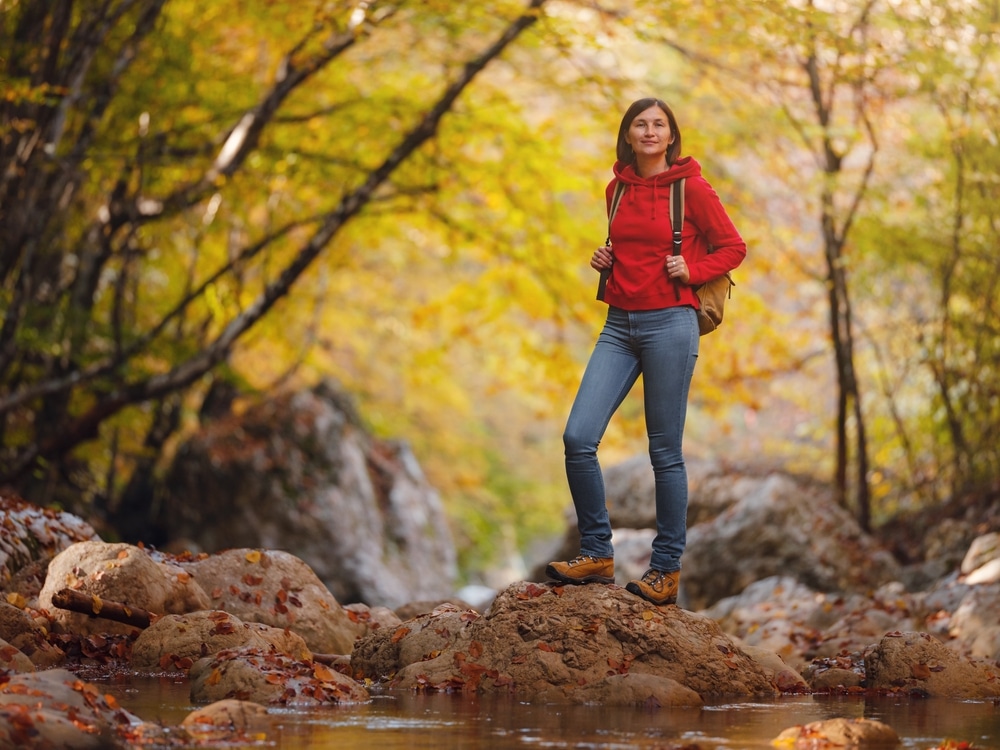 Woman hiking during the fall and enjoying all the things to do in Wausau in the fall