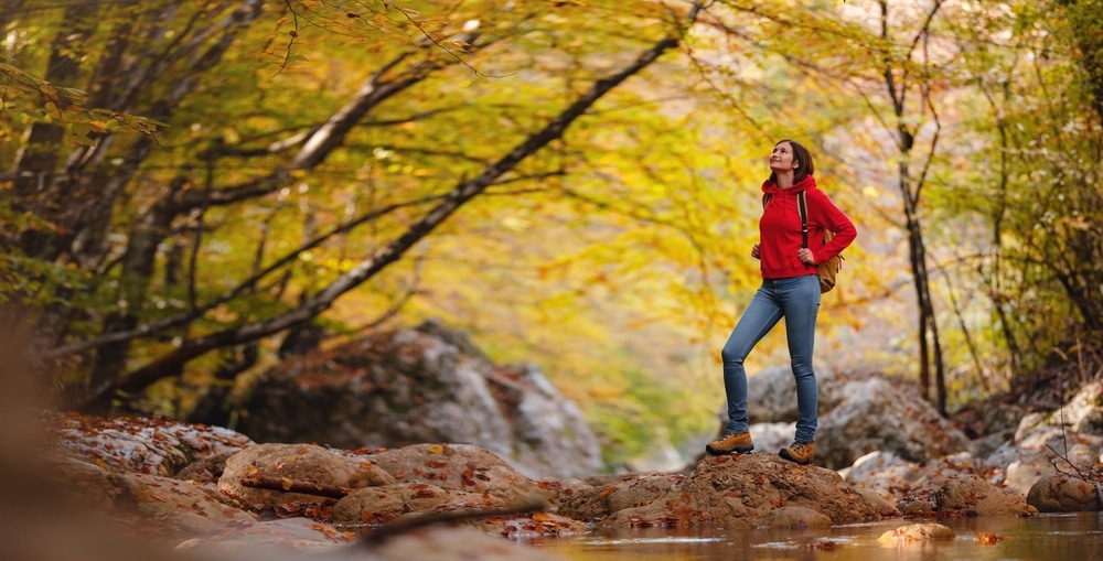 Woman enjoying one of the best hikes in Wisconsin in the fall