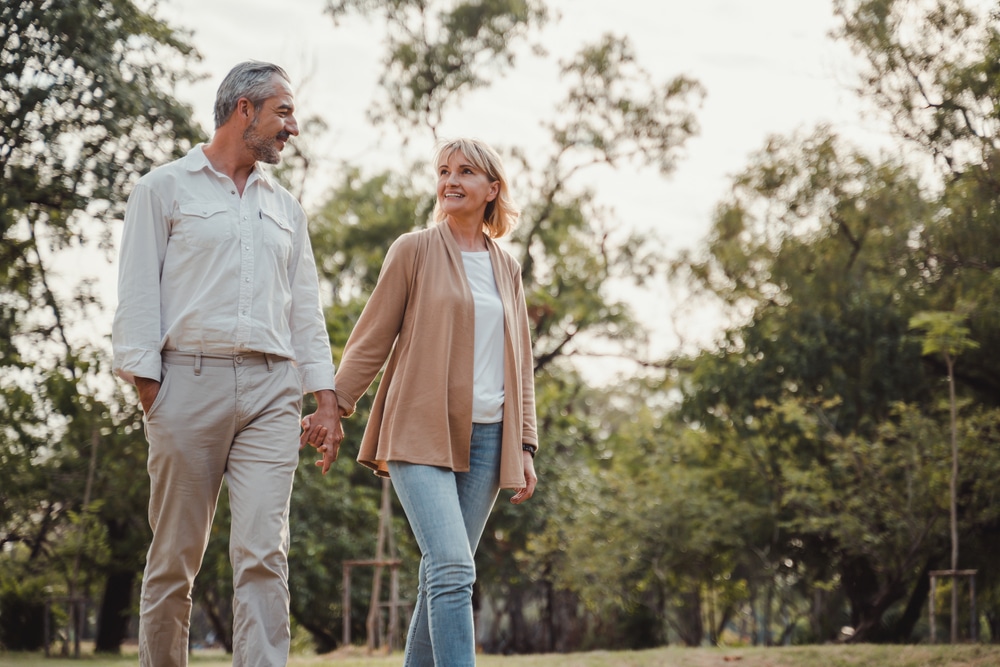 Elderly couple walking holding hands and enjoying romantic things to do in Wausau, WI